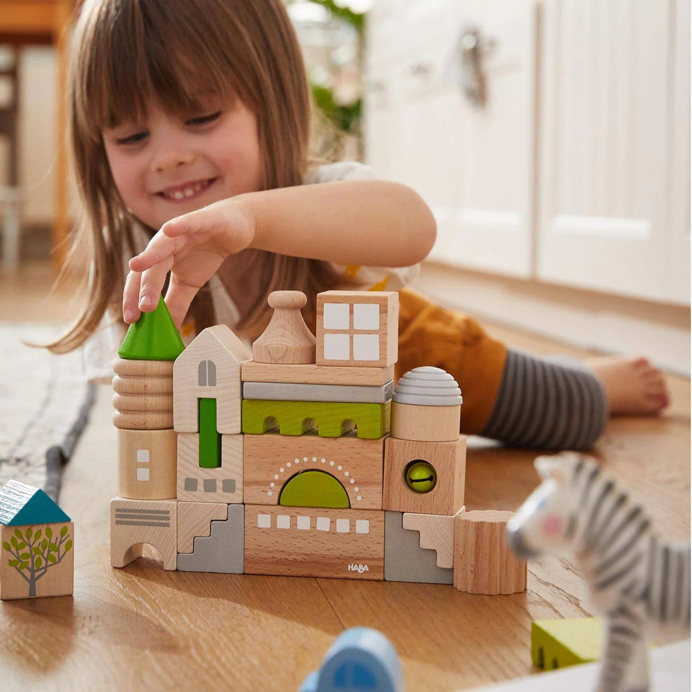 
                  
                    lifestyle image of child playing with coburg building blocks by haba - 28 pcs
                  
                