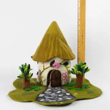 winding road felt cottage with measuring stick