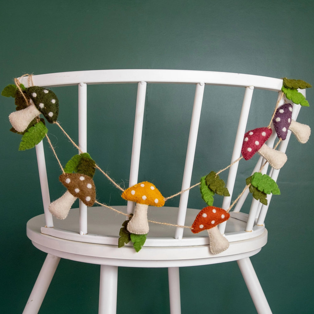 
                  
                    The Winding Road Mushroom Garland on a chair
                  
                