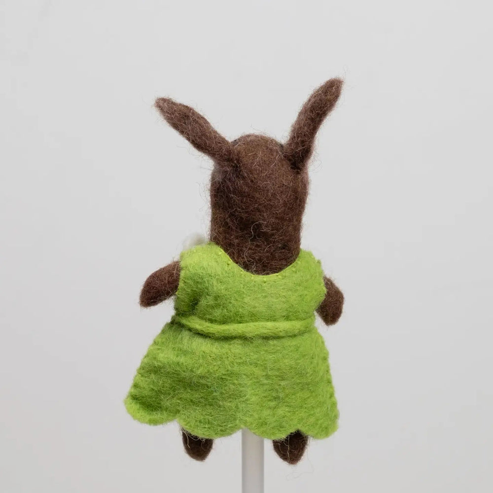 
                  
                    Backside of green felt bunny rabbit finger puppet from the winding road
                  
                