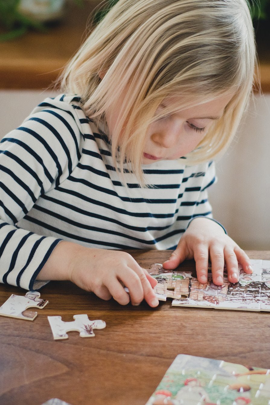 
                  
                    Elsa Beskow Elsa Beskow "Tomtebobarnen" Children of the Forest Jigsaw Puzzle Set in Wooden Box (4 puzzles - 12 pieces each) - blueottertoys-HM3258
                  
                